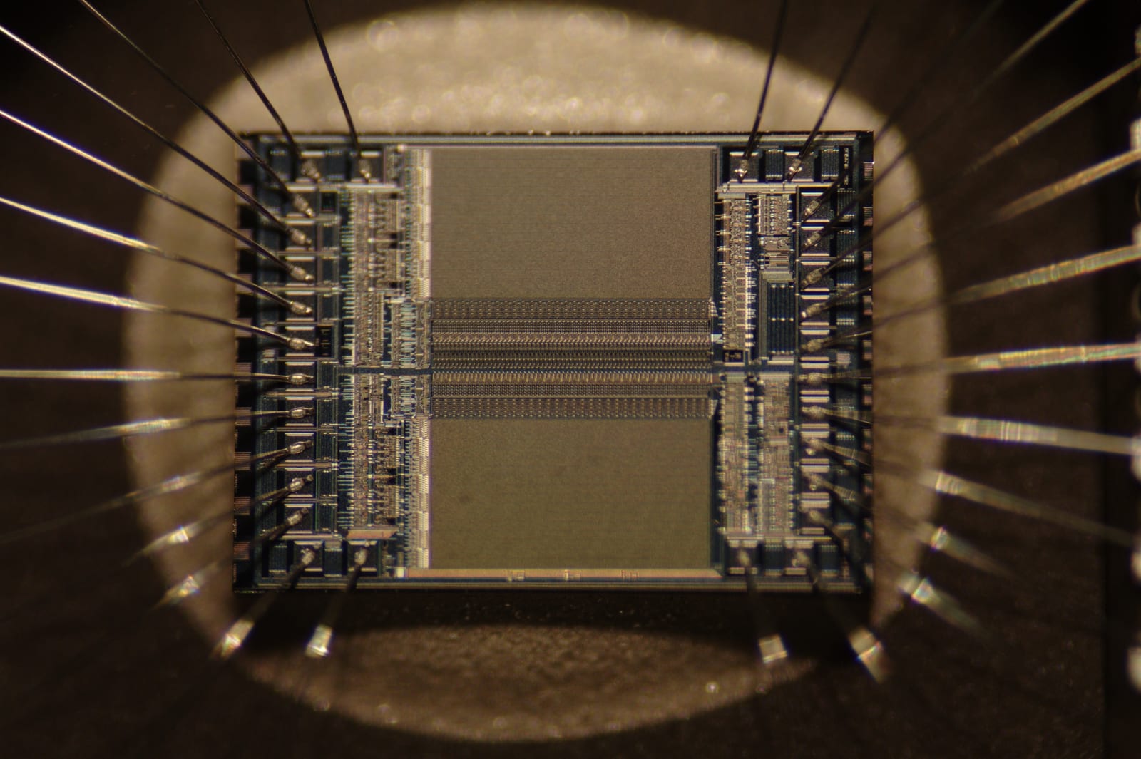 Extreme close-up of a silicon microchip showing tiny shiny circuits