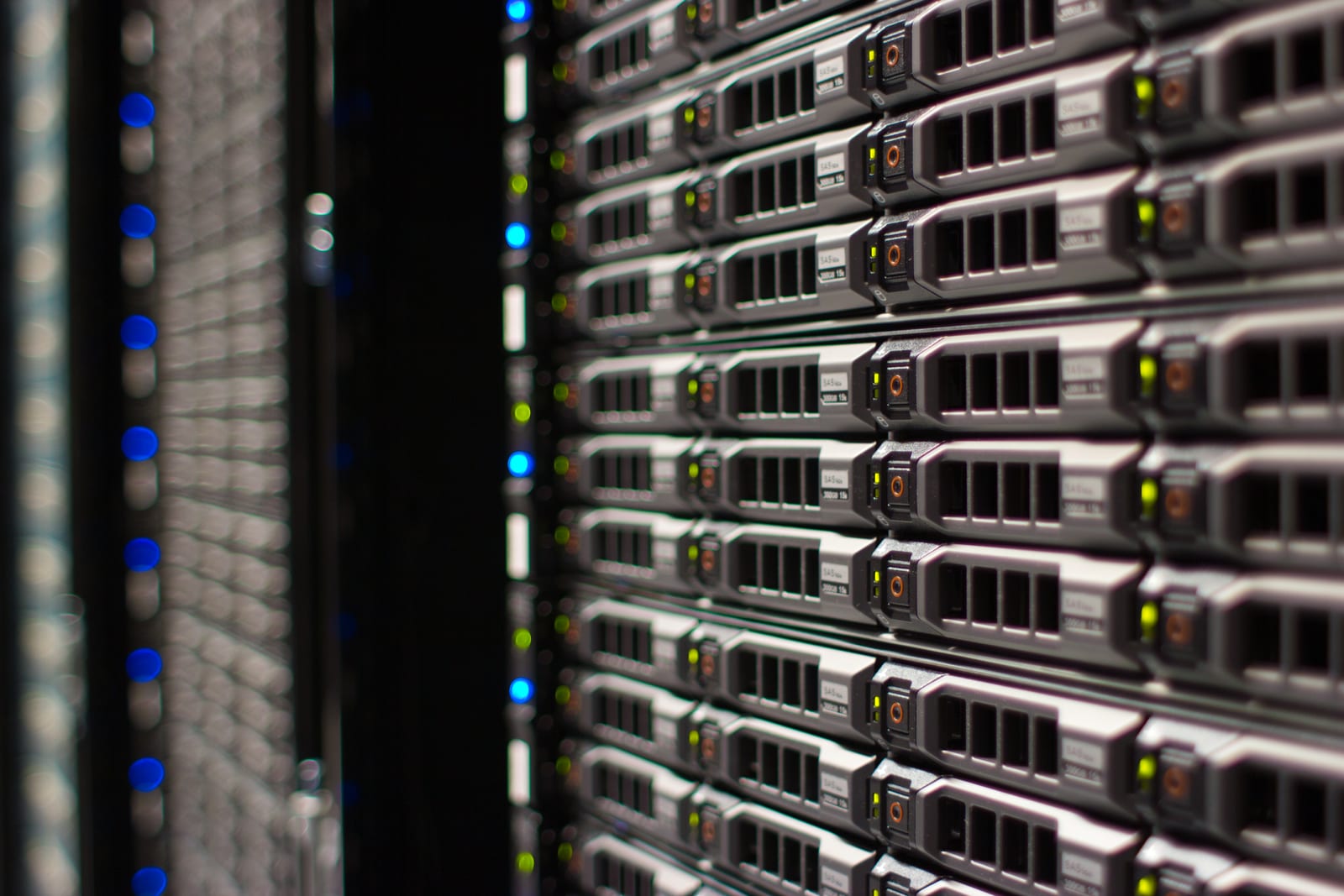 Aisle of tall server racks with blinking lights in a data center